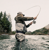Action shot of Sage R8 Premium Spey Rod in mid-cast, highlighting its dynamic bending curve and precision casting capabilities