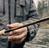Angler holding Sage R8 Premium Spey Rod, demonstrating its lightweight and balanced design for efficient fly casting