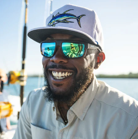 Man in saltwater fishing hat wearing Bajio Greenland Polarized Sunglasses
