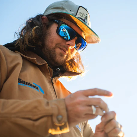 Angler wearing  Bajio Zapata Polarized Sunglasses and tying knot