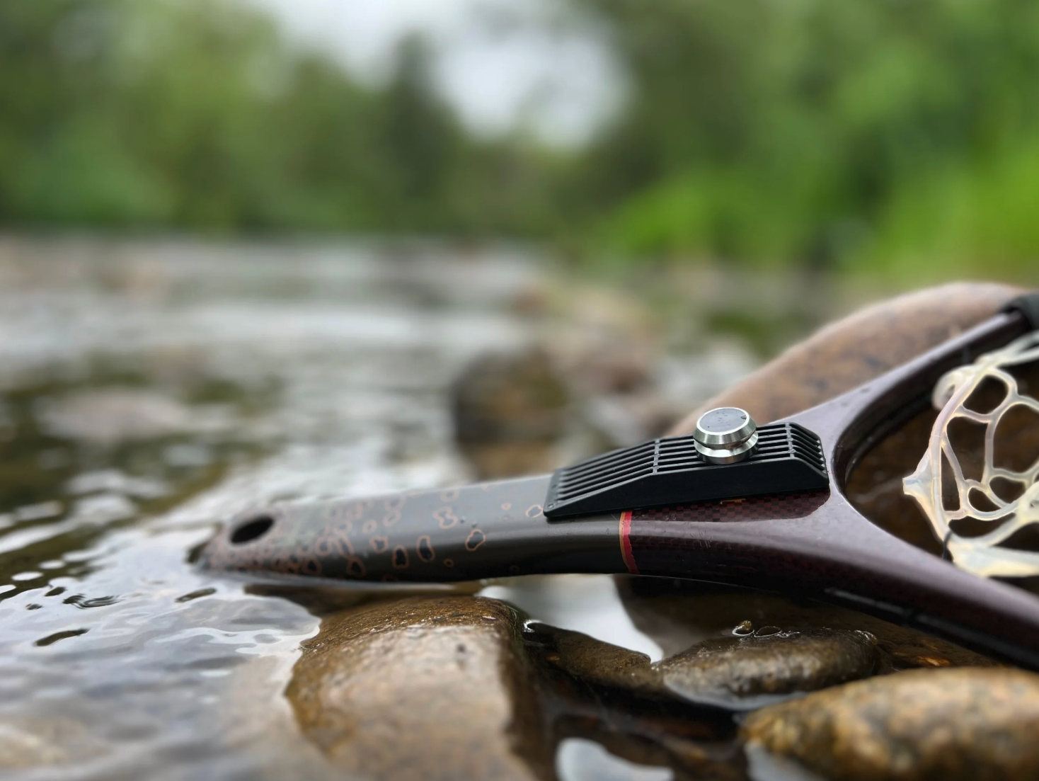 Broder Net Clip Extra Mount installed on a fly fishing landing net handle for use with the Broder net holder system