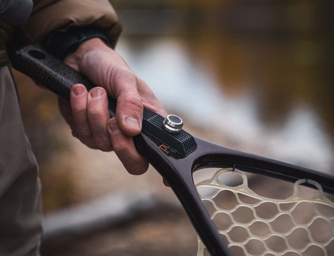 Broder Net Clip Extra Mount on landing net handle with adhesive backing and magnetic connector for secure attachment