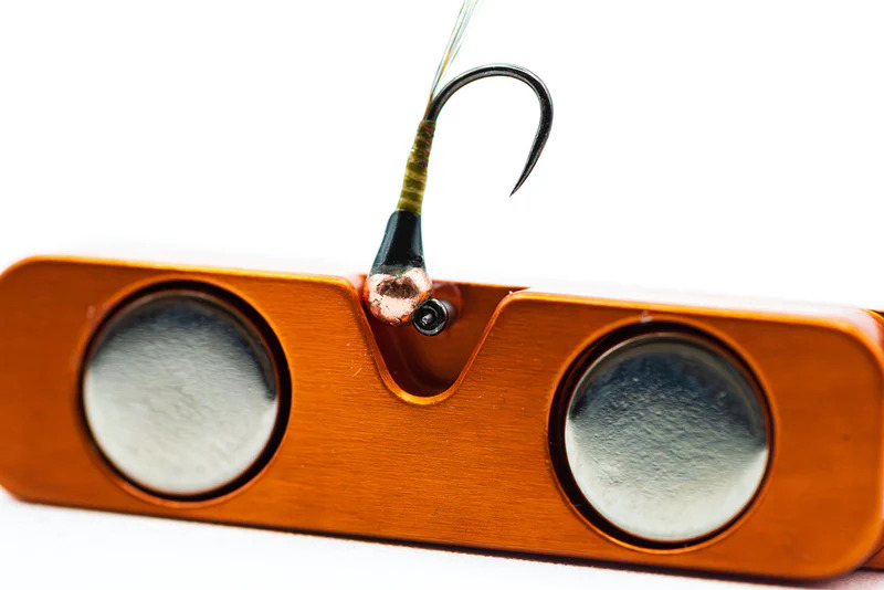 Eye cleaning needle on the Cling Mag Grab Rod Rack in use