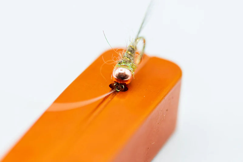 Fly threader on the Cling Mag Grab Rod Rack in use