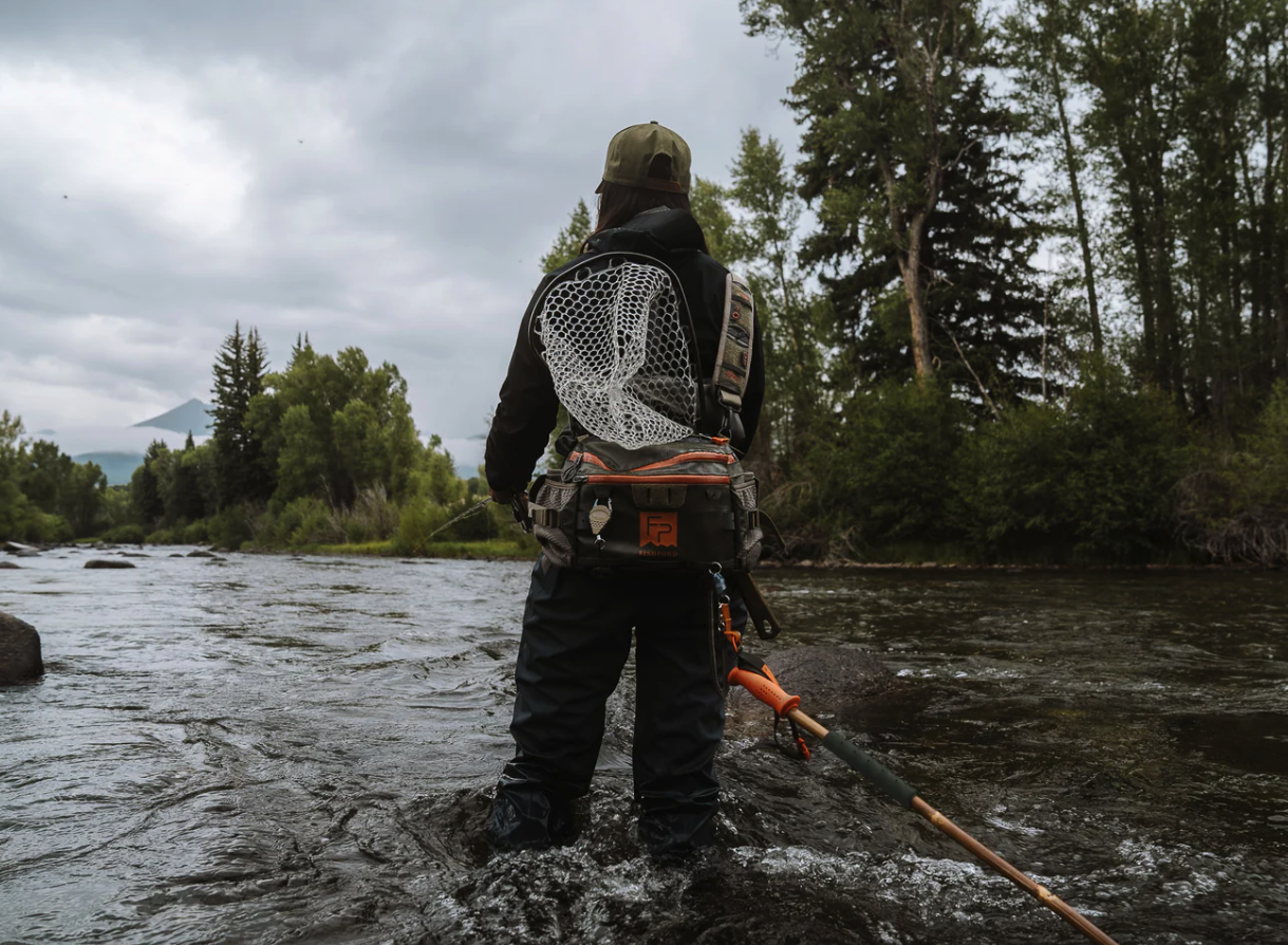 Female angler fishing with Fishpond Grass Sticks Wading Staff