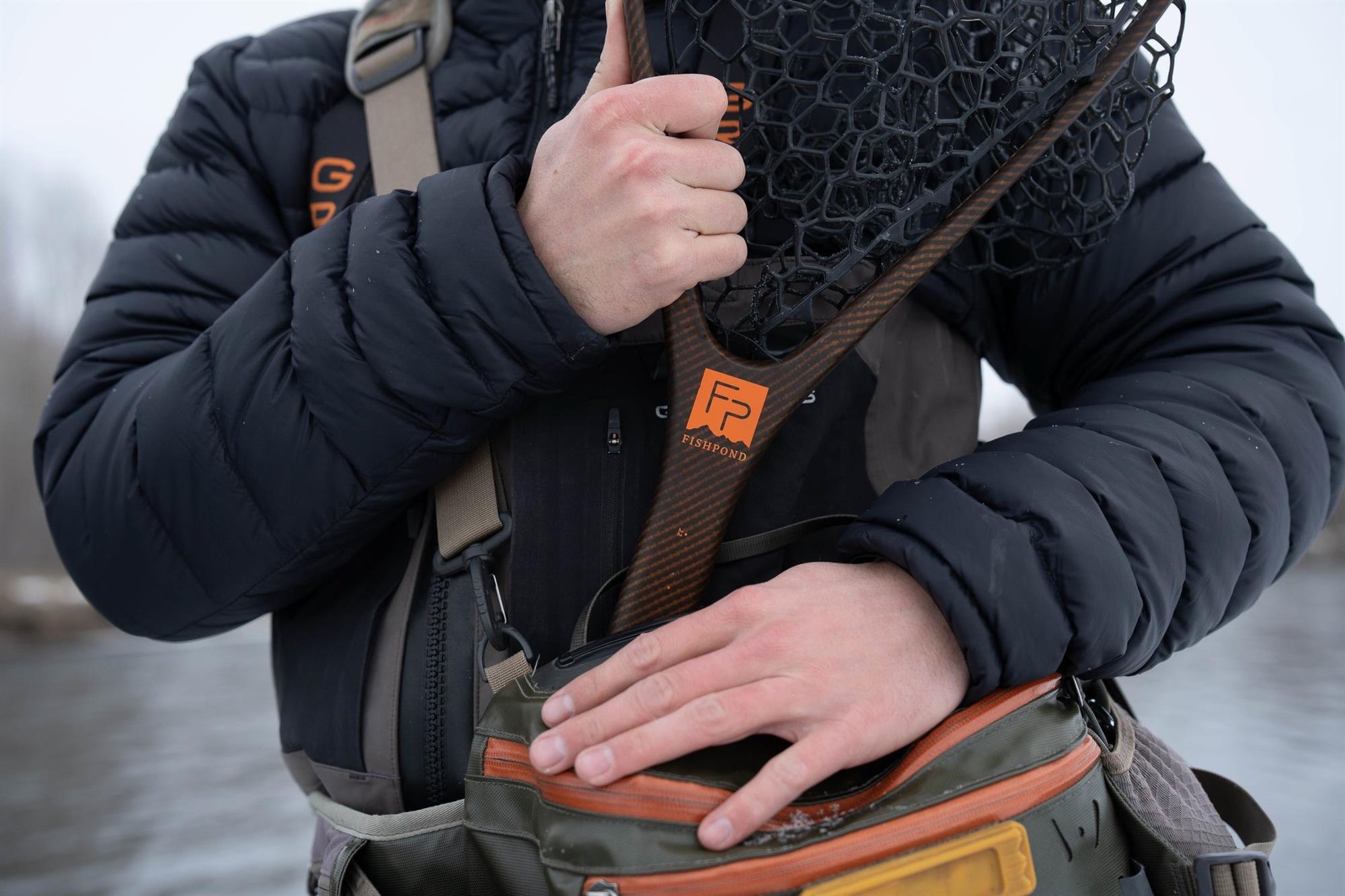 Fishpond Nomad Middle Fork net stowed in hip pack net holder for trout fly fishing