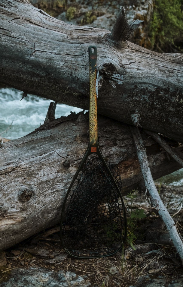 Fishpond Nomad Middle Fork Net Hook Jaw Limited Edition leaned against tree