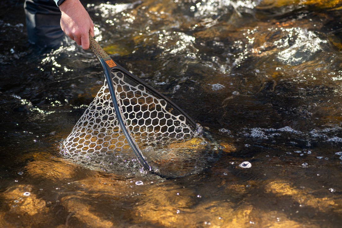 Lightweight floating Fishpond trout net in use during walk-wade fishing