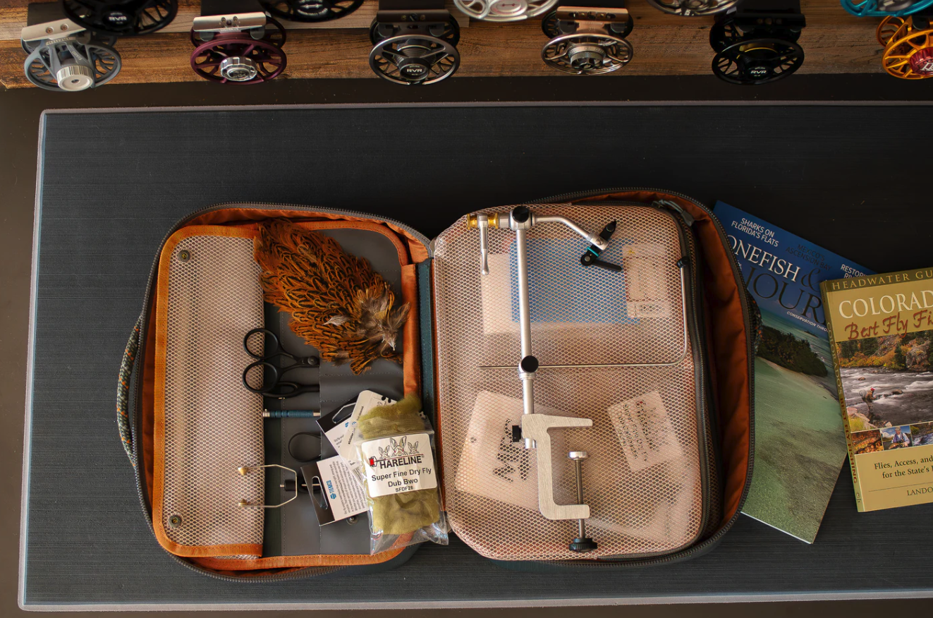 Fishpond Backwater Fly Tying Kit open with vise, tools and fly tying materials