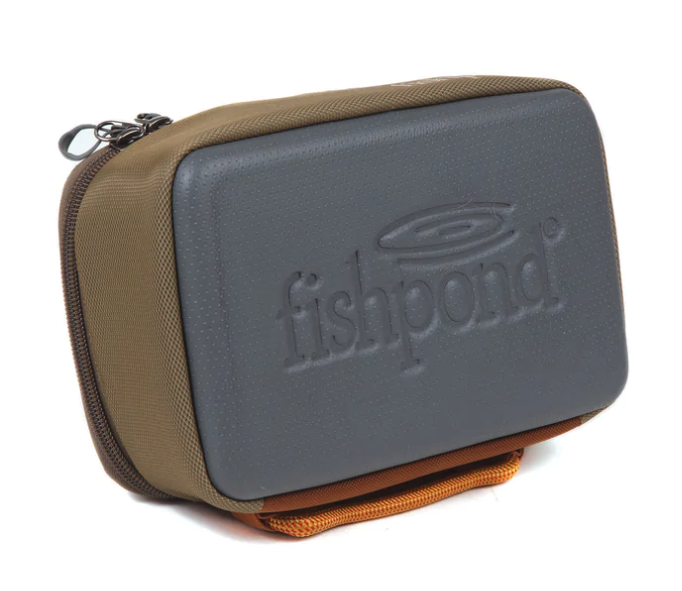 Fishpond Ripple Reel Case (Small) storing reels and tools—compact fishing reel case for efficient gear organization.