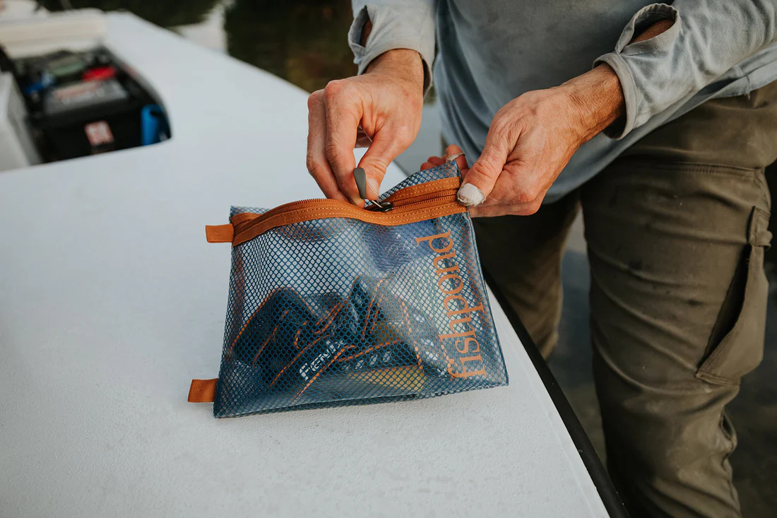 Keep your essential items safe and water proof while on the boat with the Fishpond Sandbar Travel Pouches