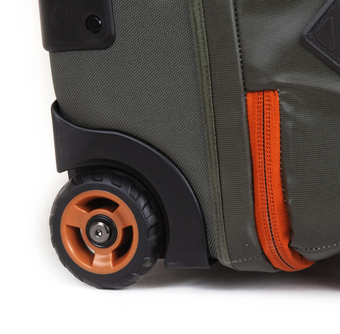 Compact Fishpond Stormshadow Rolling Carry-On for travel, featuring easy maneuverability and durability