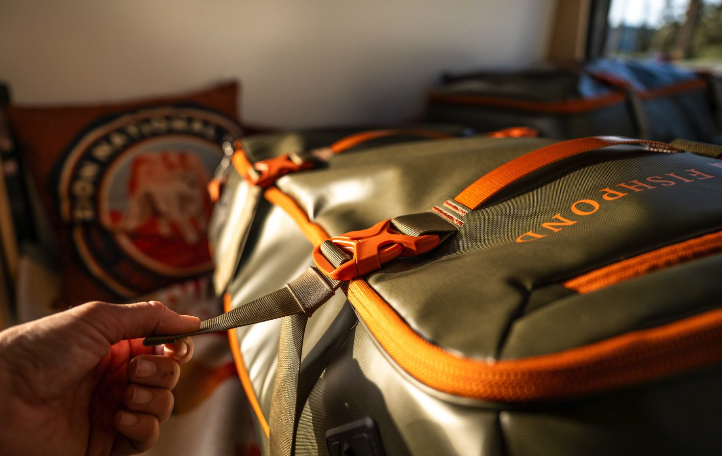 Buckle detail view of Fishpond Stormshadow Medium Rolling Duffel