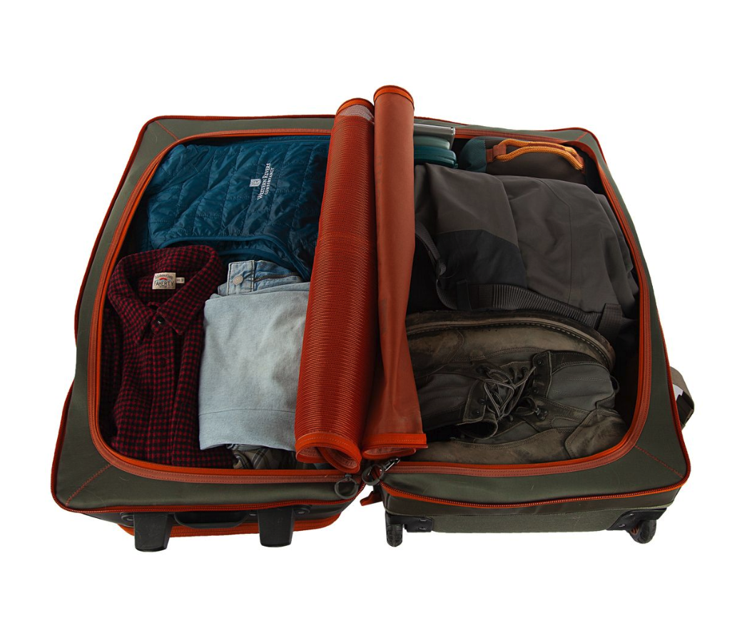 Fishpond Stormshadow Medium Rolling Duffel open with clothes