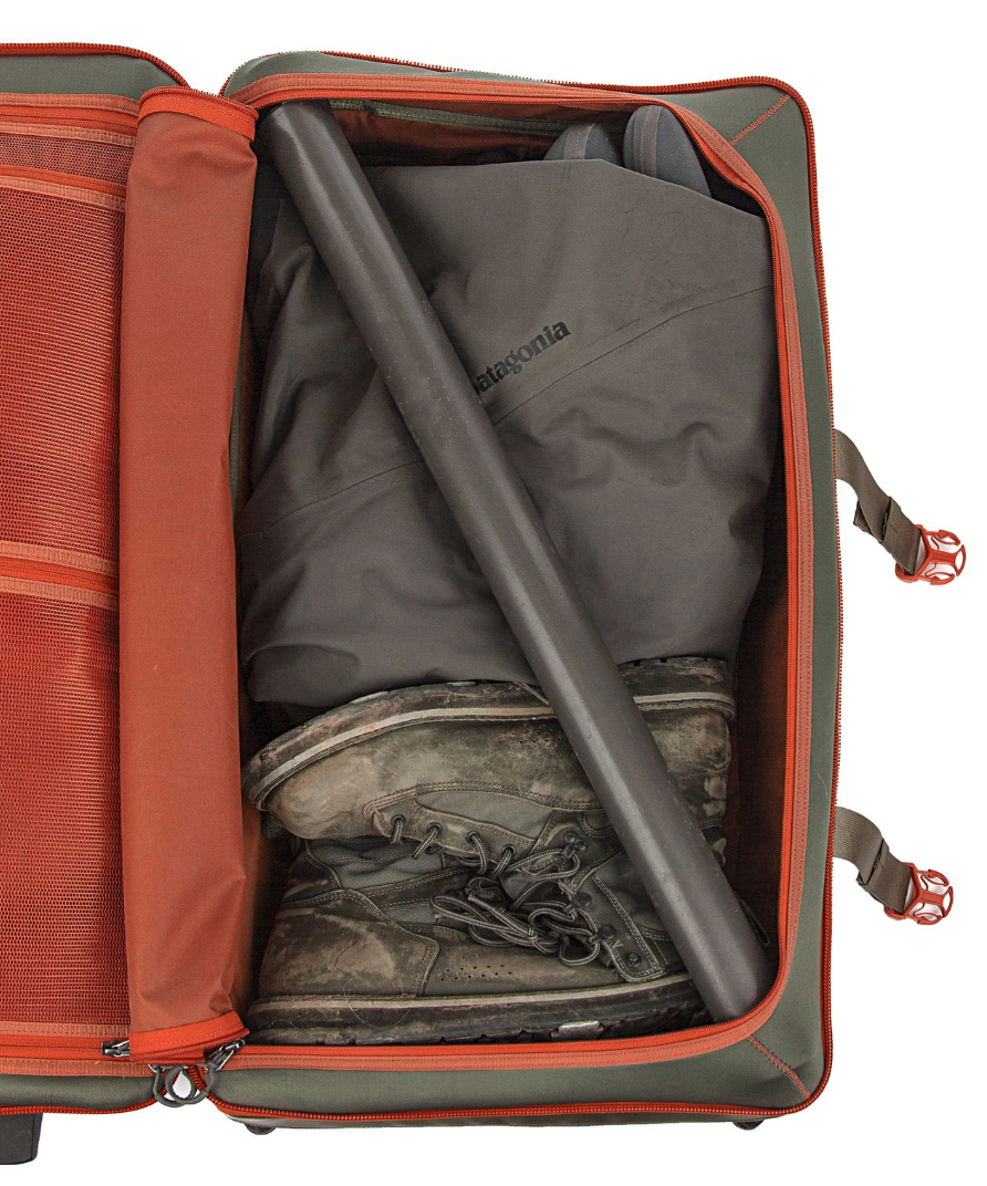 Fishpond Stormshadow Medium Rolling Duffel open with rod tube and boots