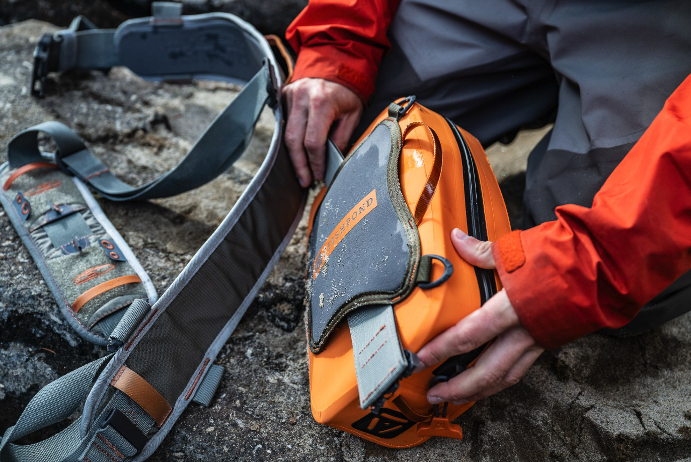 Shop Fishpond Thunderhead Submersible Lumbar Pack Small Cutthroat Orange online with free shipping.