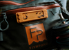 Close up of  Fishpond Tacky Fly Dock MagPad Burnt Orange on hip pack