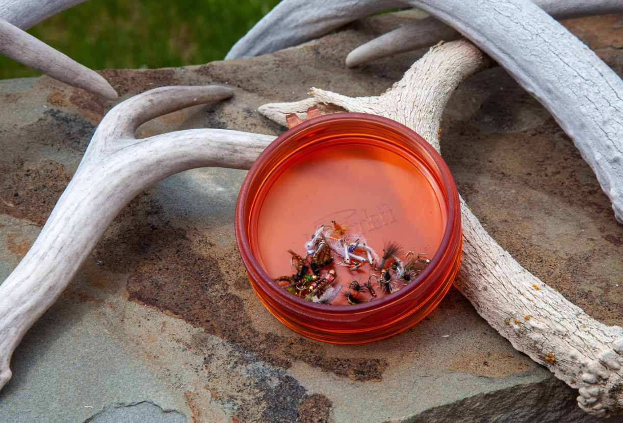 Fishpond Tacky Shallow Fly Puck hold small fishing flies conveniently.