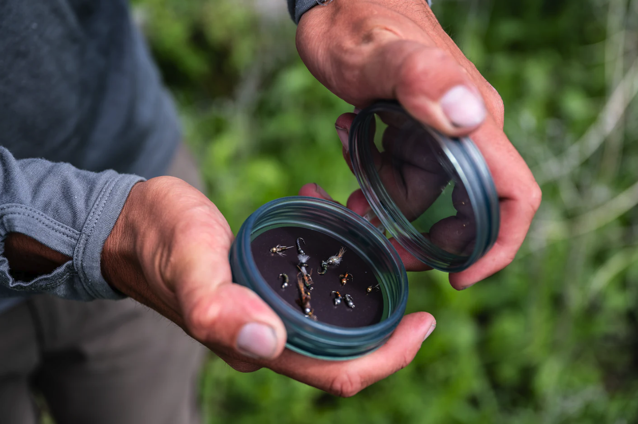 Fishpond Shallow MagPad Fly Puck has a magnetic bottom to keep trout flies secure.