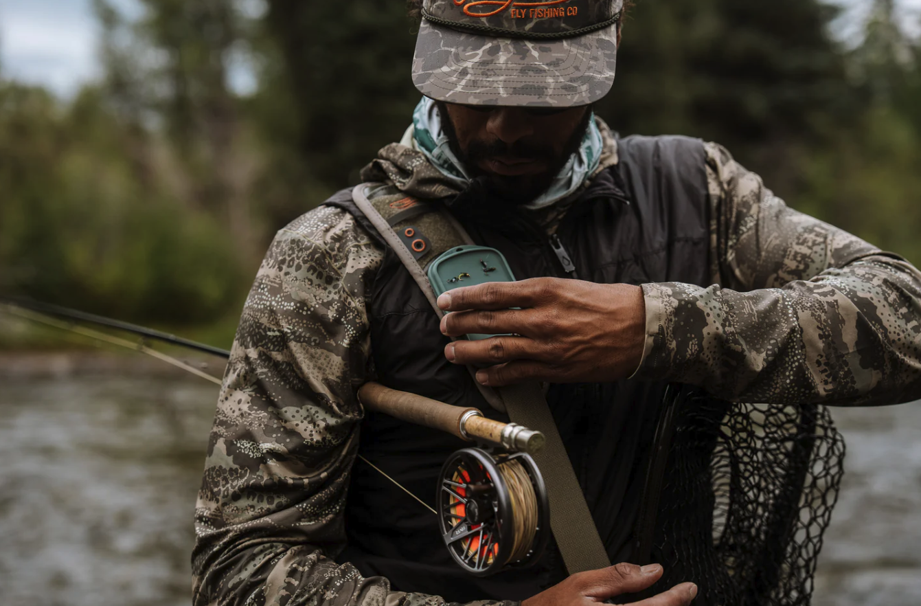 Angler with Fishpond Tacky Grande Fly Dock MagPad on shoulder strap