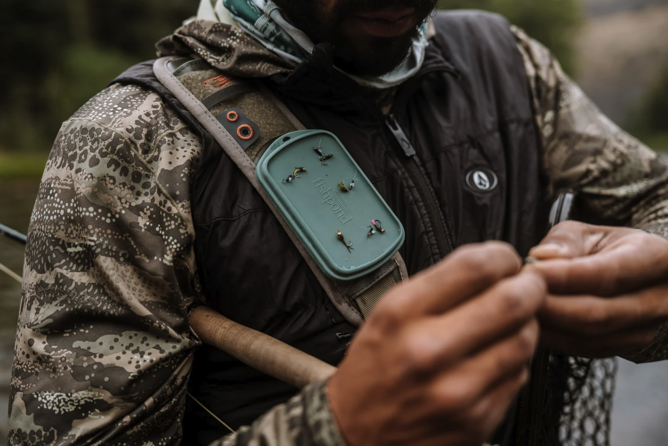 Flies on Fishpond Tacky Grande Fly Dock MagPad placed on shoulder pack strap