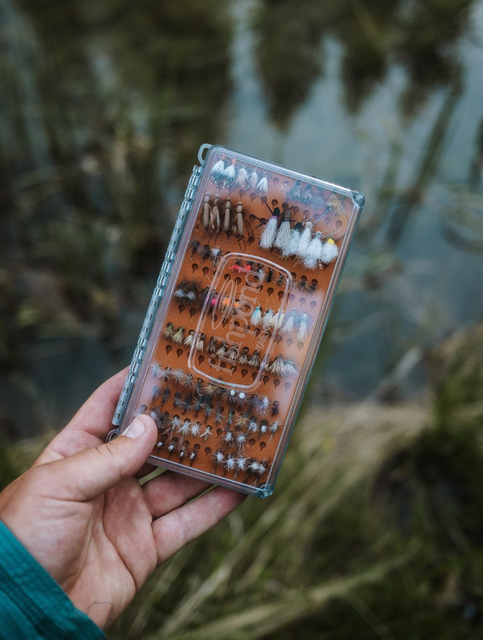 Angler holding  Tacky Original Fly Box Burnt Orange