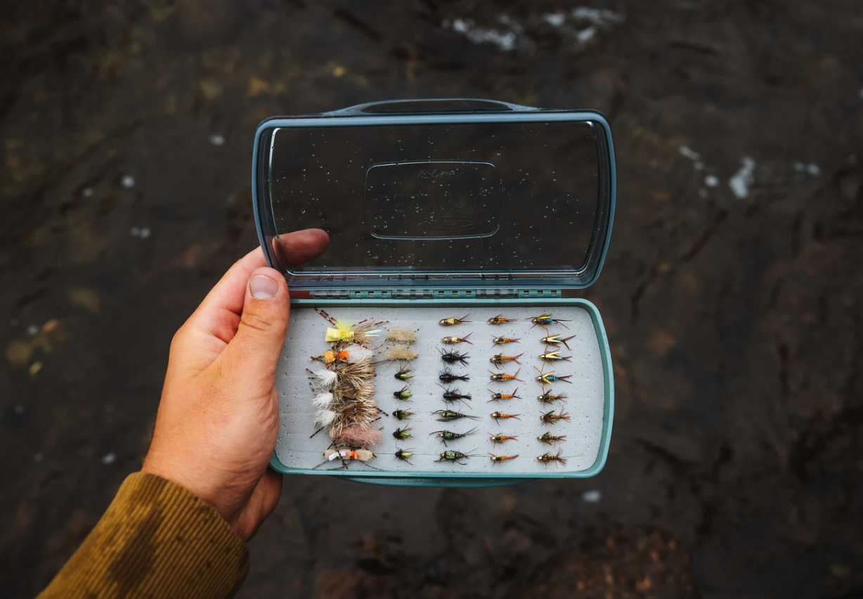 Holding Fishpond Tacky Pescador Dynamic Foam Clear Lid Fly Box Medium open with flies