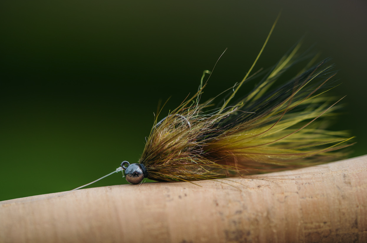 Gamebird fly on cork fly rod handle.