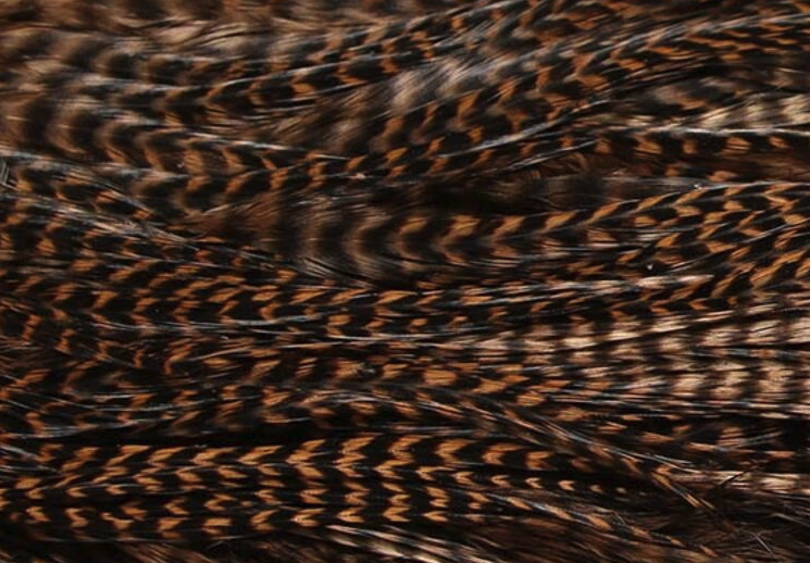 Half saddle in tan, a classic choice for tying flies that mimic natural baitfish for pike