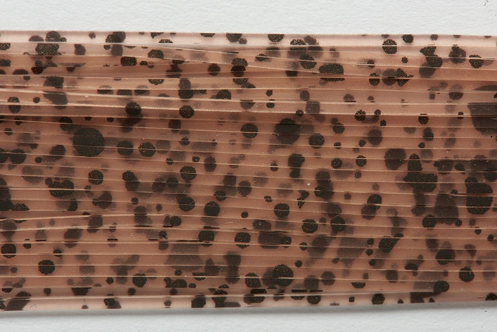 Fulling Mill Splash Legs – natural craw speckled rubber legs close-up for trout and bass flies