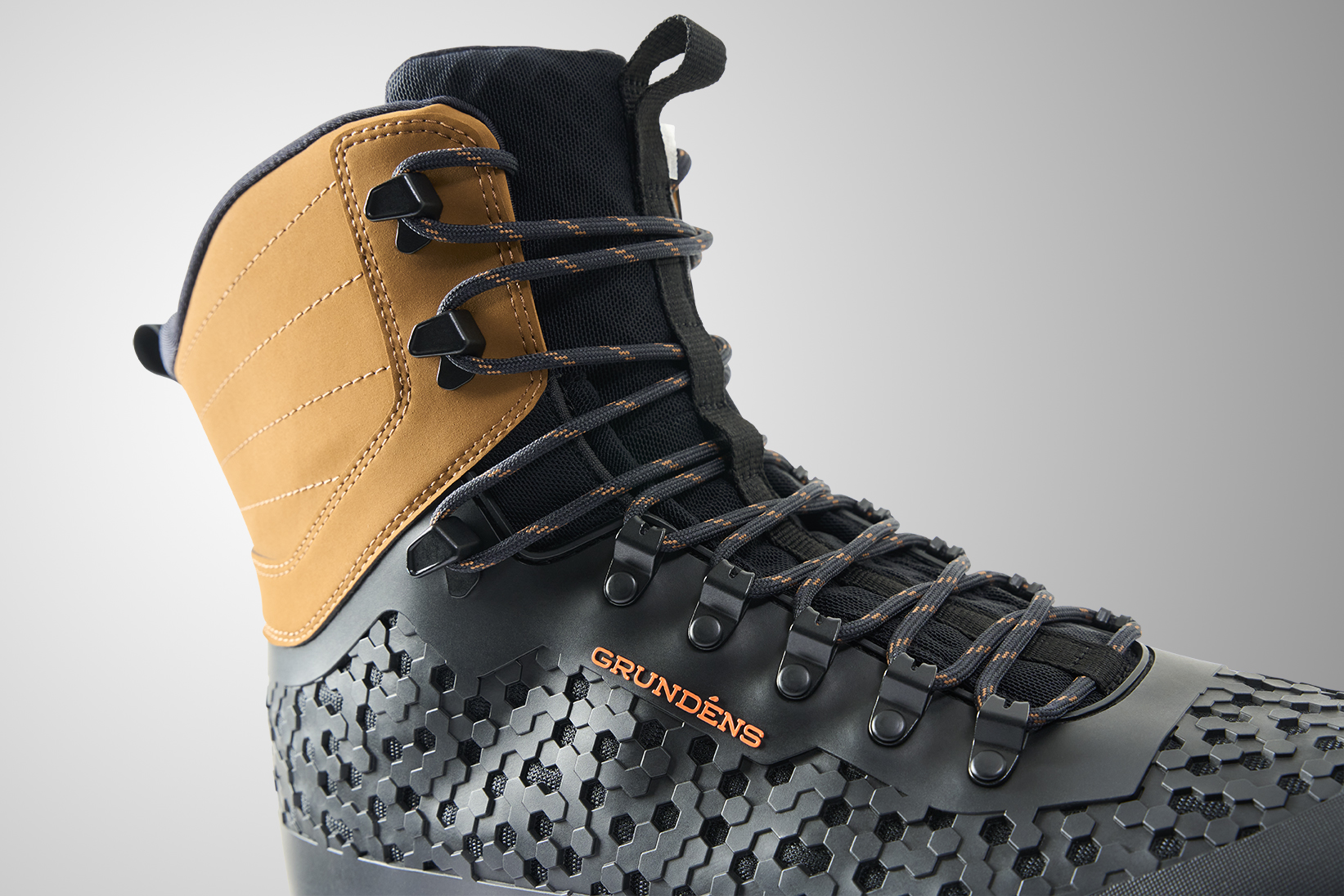 Grundens Rock Armor wading boot close up durable lacing system and protective molded upper