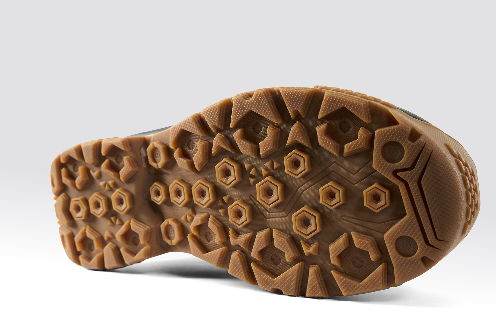 Grundens Rock Armor wading boot outsole aggressive rubber traction pattern for slippery rocks