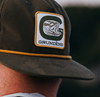 Classic Rope Hat by Grundens with a retro design, breathable mesh back, and adjustable snap closure.