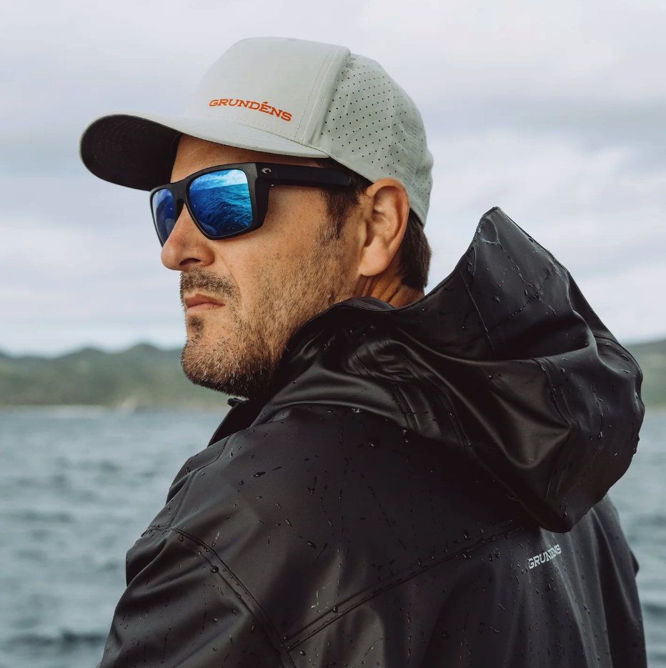 Angler wearing Grundens ICONic Vented Hat with other Grundens rain gear