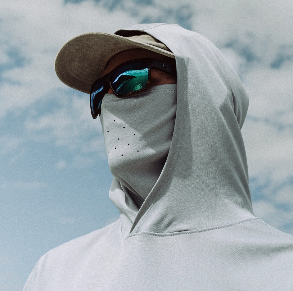 Man wearing sunglasses and Grundens Tough Sun Masked Hoodie with mask up
