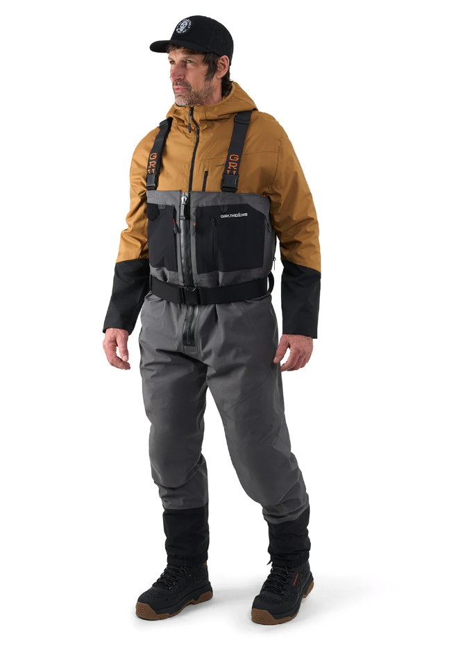 Angled view of model wearing Grundens Vector Zip Waders