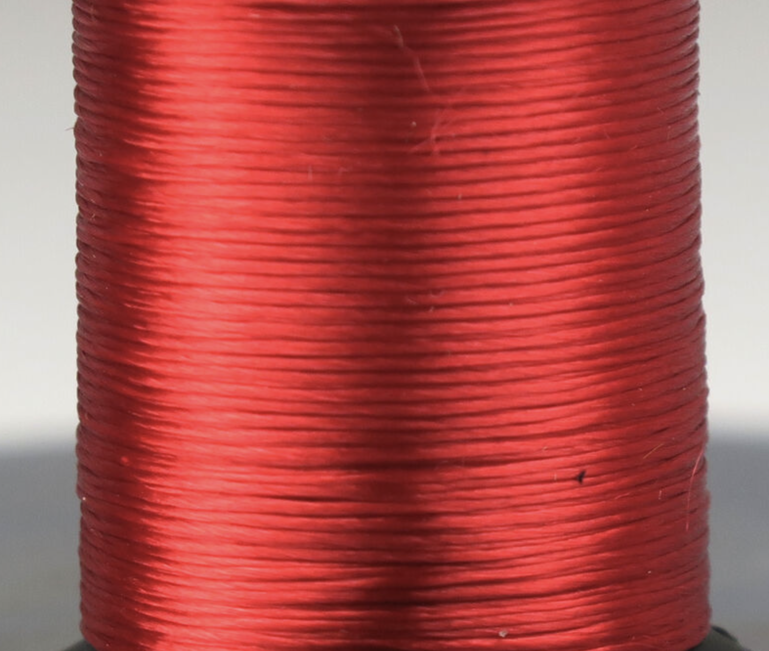 Vibrant red Uni-Floss fly tying material for creating irresistible trout flies