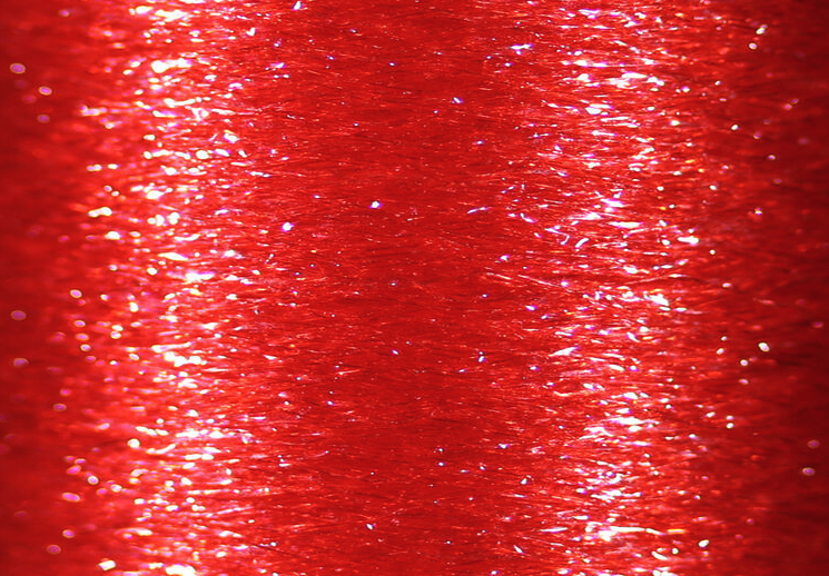 UV reflective Veevus Body Quill in hot orange for high visibility fly tying applications