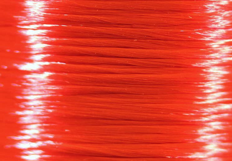Premium Veevus Floss in fluorescent fire red, adding a creative twist to traditional fly designs