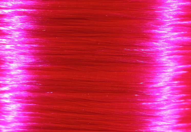 Easy-to-wrap Veevus Floss in fluorescent hot pink, adding a pop of color to your fly fishing arsenal