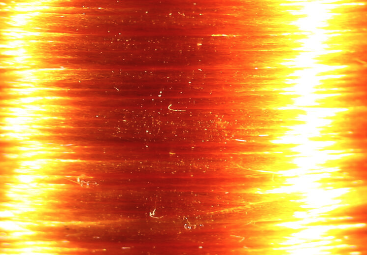 High-quality Veevus Floss in orange, essential for tying attractive salmon and trout flies.