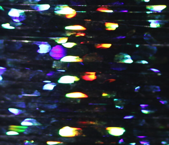 Black Veevus Holographic Tinsel, adding a unique, iridescent touch to various fly patterns