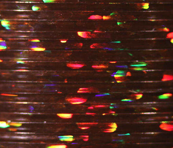 Brown Veevus Holographic Tinsel, ideal for tying natural-looking, reflective nymphs and streamers.