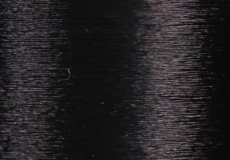 Veevus 14/0 black thread, ideal for tying fine and detailed small trout nymphs.