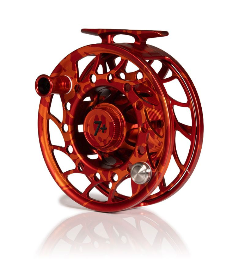 Angled view of Mid Arbor Hatch Iconic Fly Reel 7 Plus Magma Red Orange Limited Edition