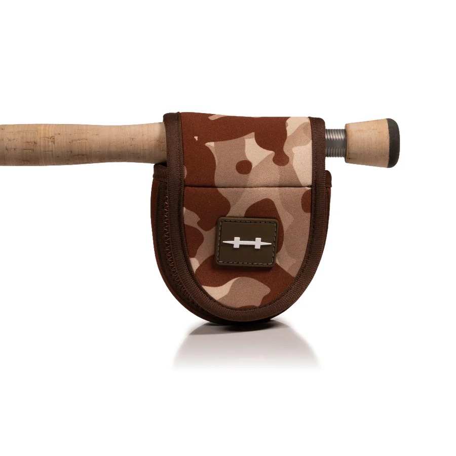 Hatch Iconic reel pouch shown over rigged fly rod for on-the-go reel protection