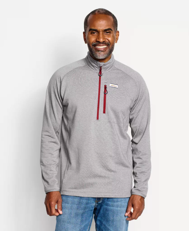 Stylish quarter-zip fleece pullover for layering in outdoor activities.
