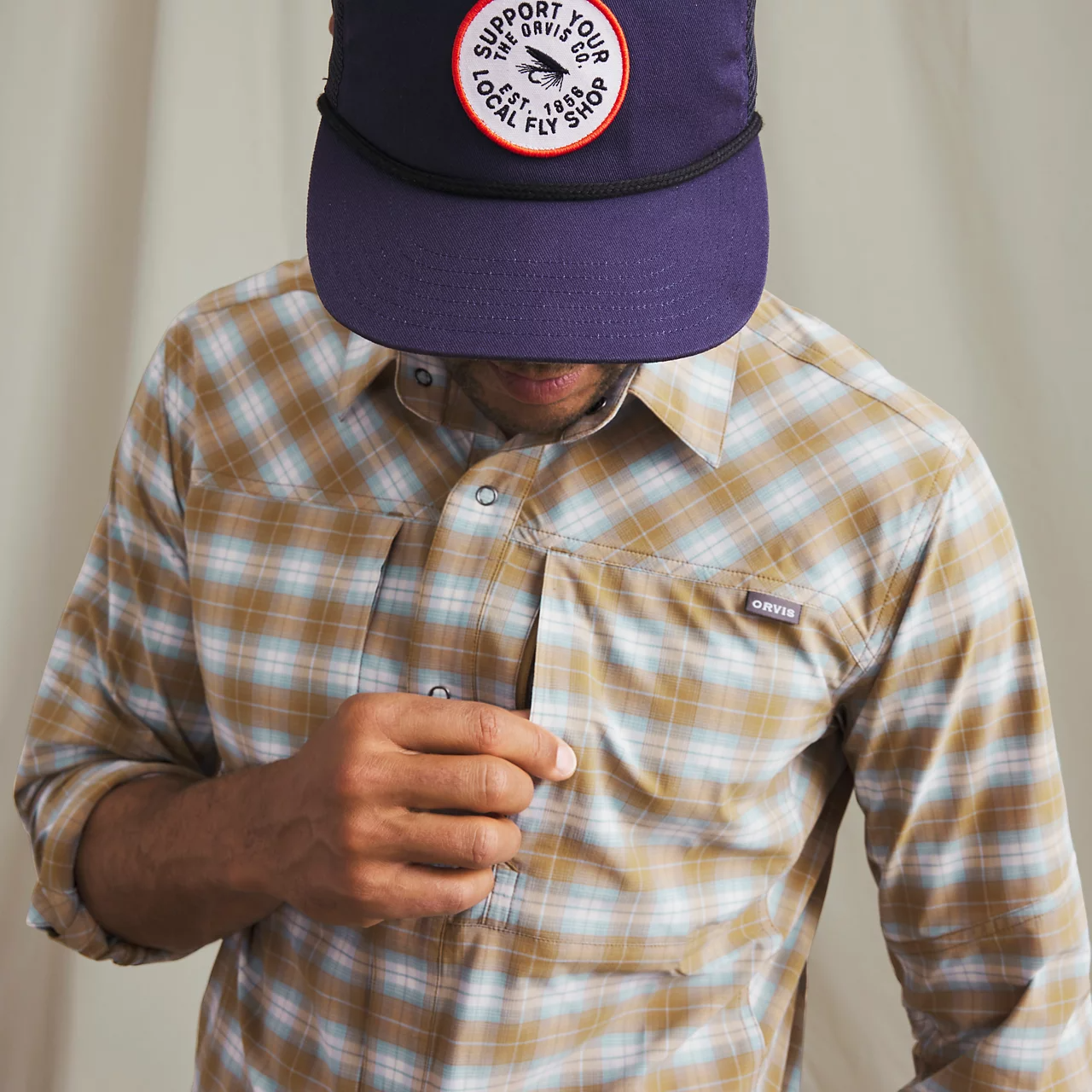 Orvis PRO stretch shirt detail chest pocket snap button technical fishing apparel close up