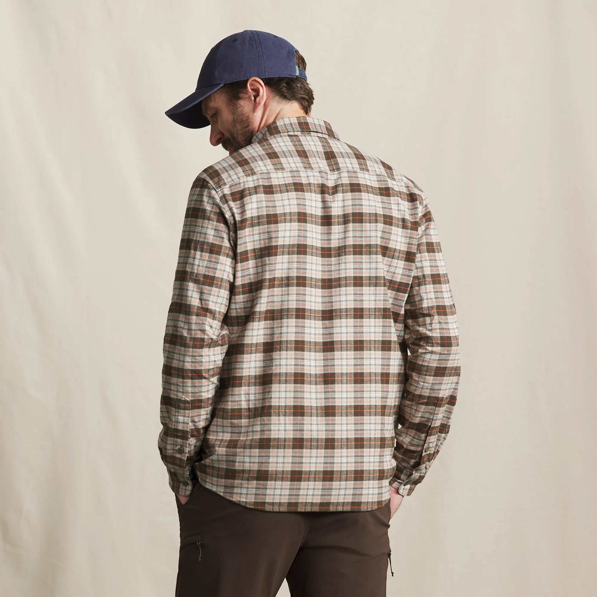 Men's Orvis Flat Creek Tech Flannel outdoor shirt shown from behind with long sleeves and a plaid pattern.