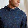 Close up view of model wearing the Orvis Sun Defense Hoodie showing True Navy Permit pattern